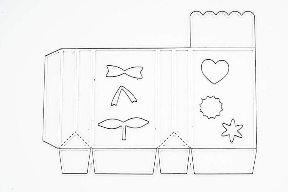 Die Stanzenshop.de Stanzschablone Schachtel mit Verzierungen bietet eine faltbare Schachtelschablone mit Fliege, Blatt, Herz, Stern, Blumenausstanzungen und Wellenschliff - perfekt für kreative Geschenkschachteln und Gastgeschenke.