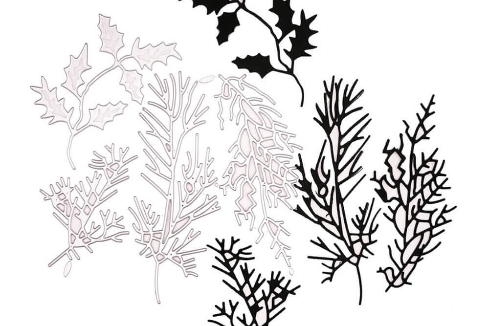 Ein Schwarz-Weiß-Bild verschiedener Blätter und Stechpalmen, erstellt mit der Stanzschablone Vier Verschiedene Zweige von Stanzenshop.de.