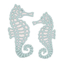 Stanzschablone Zwei Seepferdchen von Stanzenshop.de: Zwei stilisierte, hellblaue Seepferdchen mit Cut-out-Mustern und geschwungenen Schwänzen - ideal für Scrapbooking oder Bastelprojekte.