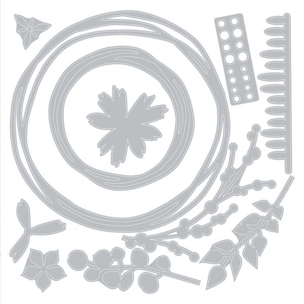 Ein weißer Kreis mit einer Thinlits Stanzschablonen-Set 11 St. Wintergirlande von Pete Hughes Blume, Blättern und anderen Artikeln von Sizzix.